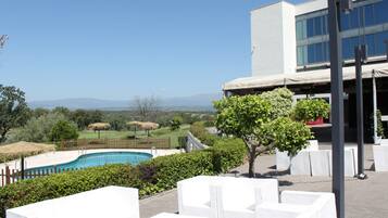 Seasonal outdoor pool, pool loungers