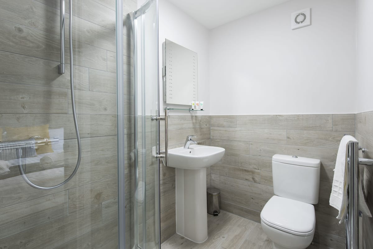 eco-friendly toiletries, hair dryer, slippers, towels