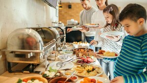 A buffet with various dishes and a self-service food station. - Skiathos Holiday Resort (Skiathos)