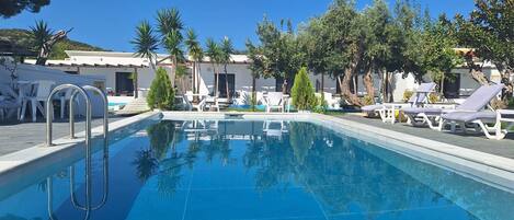 Seasonal outdoor pool, open 10:30 AM to 8:00 PM, pool umbrellas