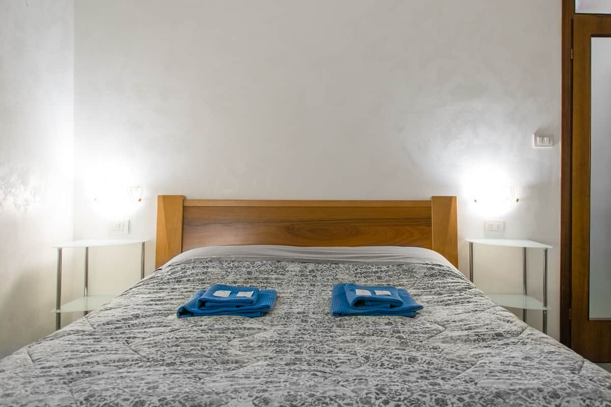 Apartment, 2 Bedrooms (River House Corso Cavour 34) | Desk, blackout drapes, iron/ironing board (on request)