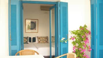 Apartment, 1 Bedroom, Balcony, Sea View | Living area | Flat-screen TV, DVD player, books, music library