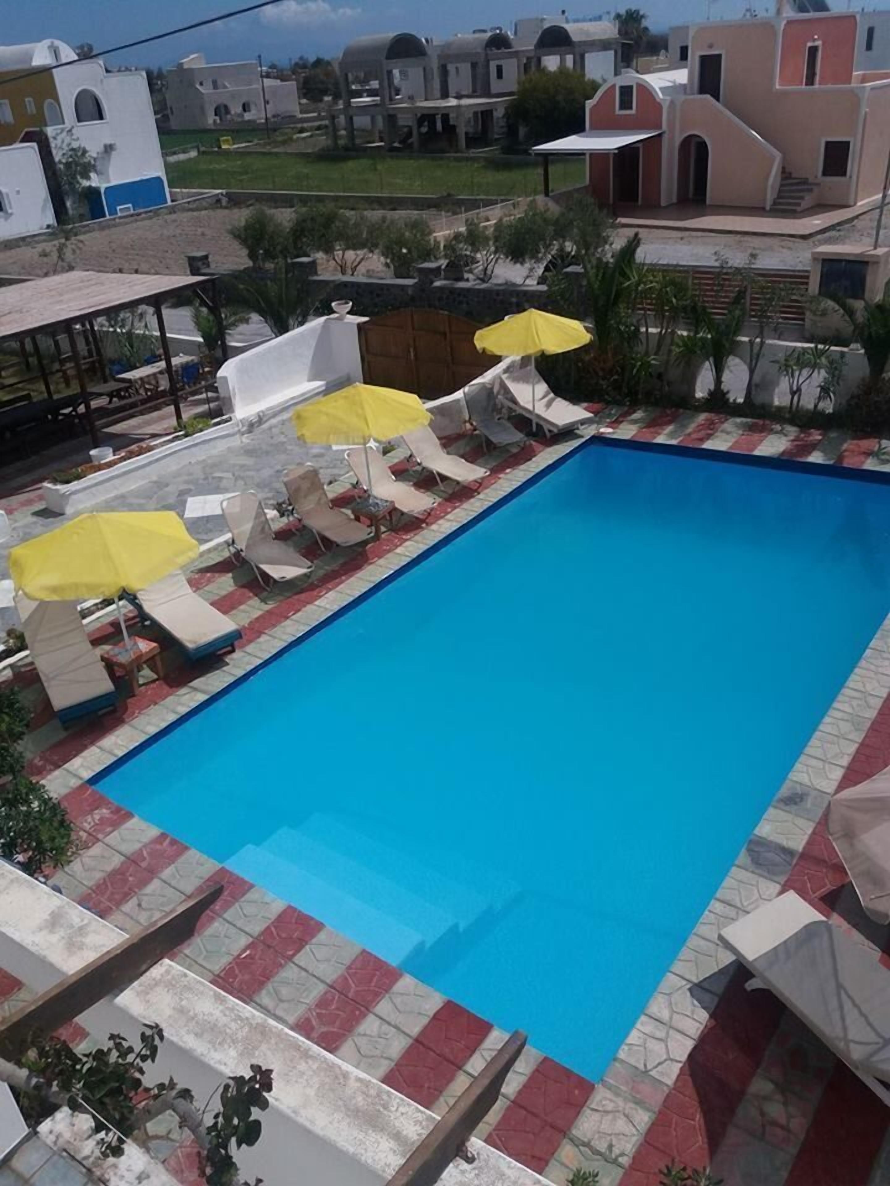 outdoor pool, pool umbrellas, pool loungers