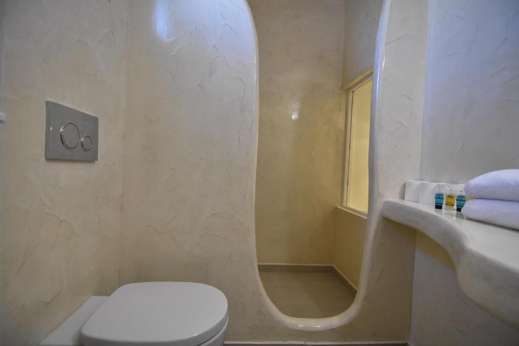 luxury studio suite | bathroom | shower, free toiletries, hair dryer, soap