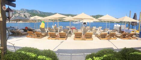 Private beach, sun loungers, beach umbrellas, beach bar