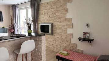 Design Studio, 1 Queen Bed with Sofa bed, Terrace, Ground Floor | Living area