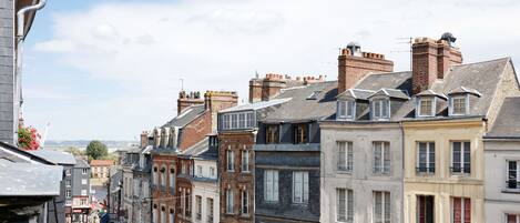 A row of historic buildings with varied architectural styles, including brick facades and multiple stories.
