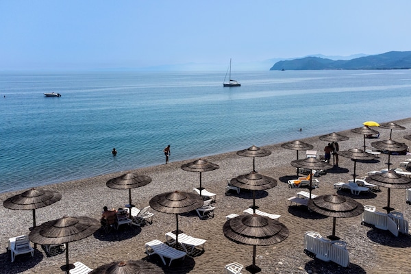 Private beach, sun loungers, beach umbrellas