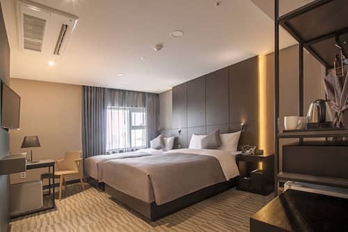 Family Twin Room | In-room safe, desk, blackout curtains, iron/ironing board