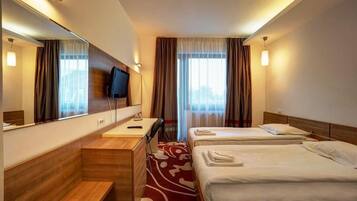 Classic Twin Room | Minibar, in-room safe, desk, laptop workspace