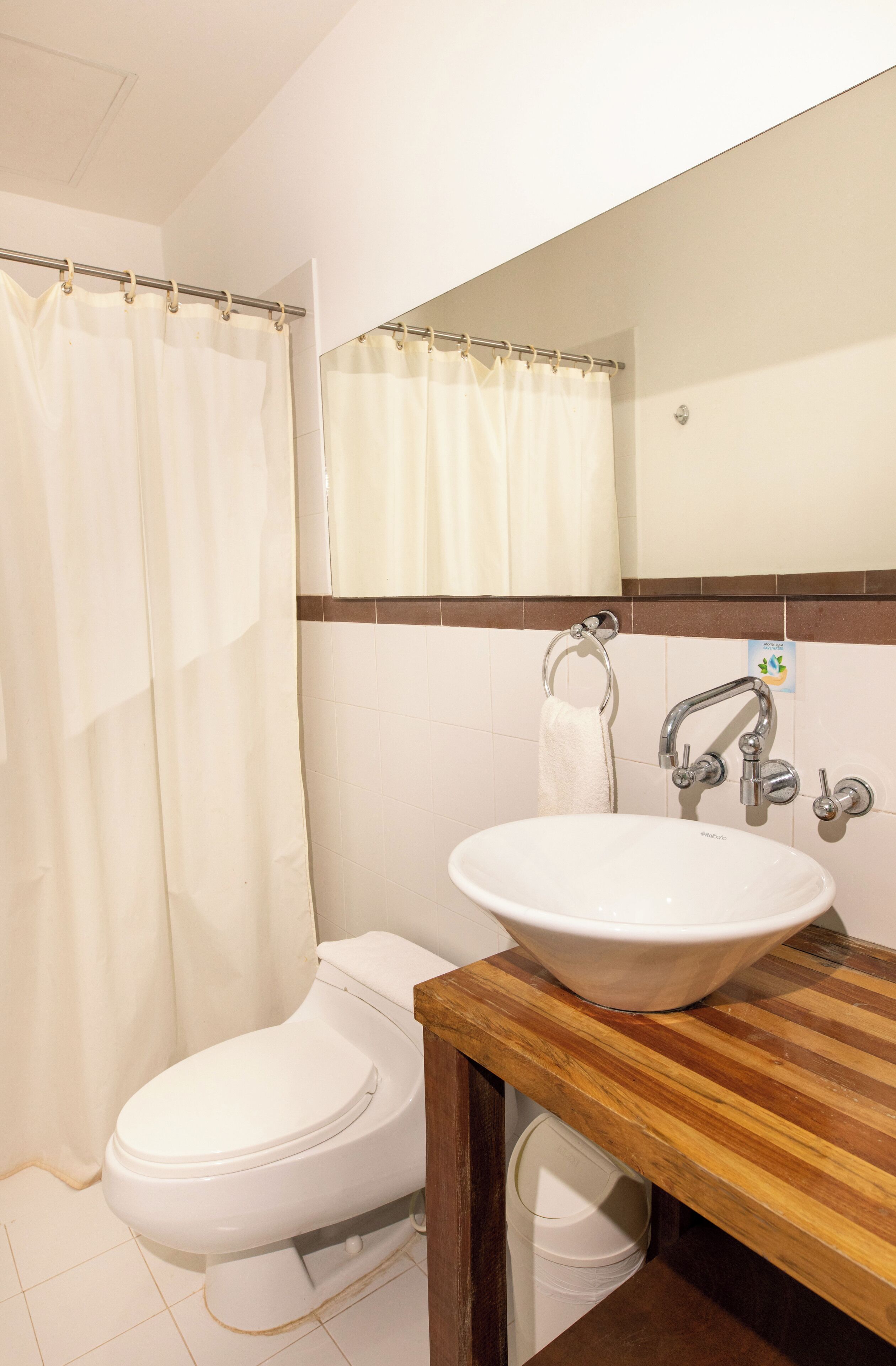 shower, designer toiletries, towels, toilet paper