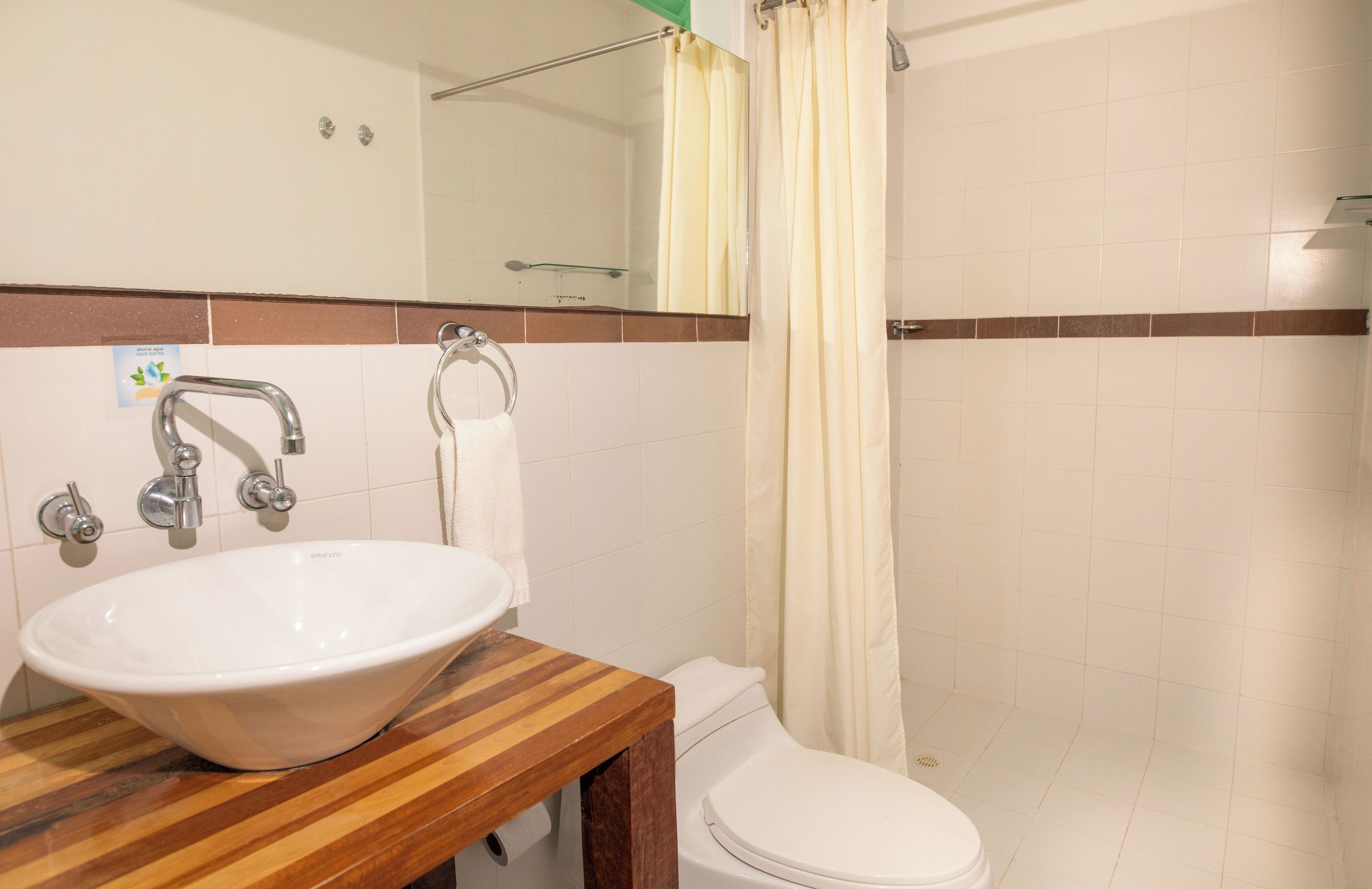 shower, designer toiletries, towels, toilet paper