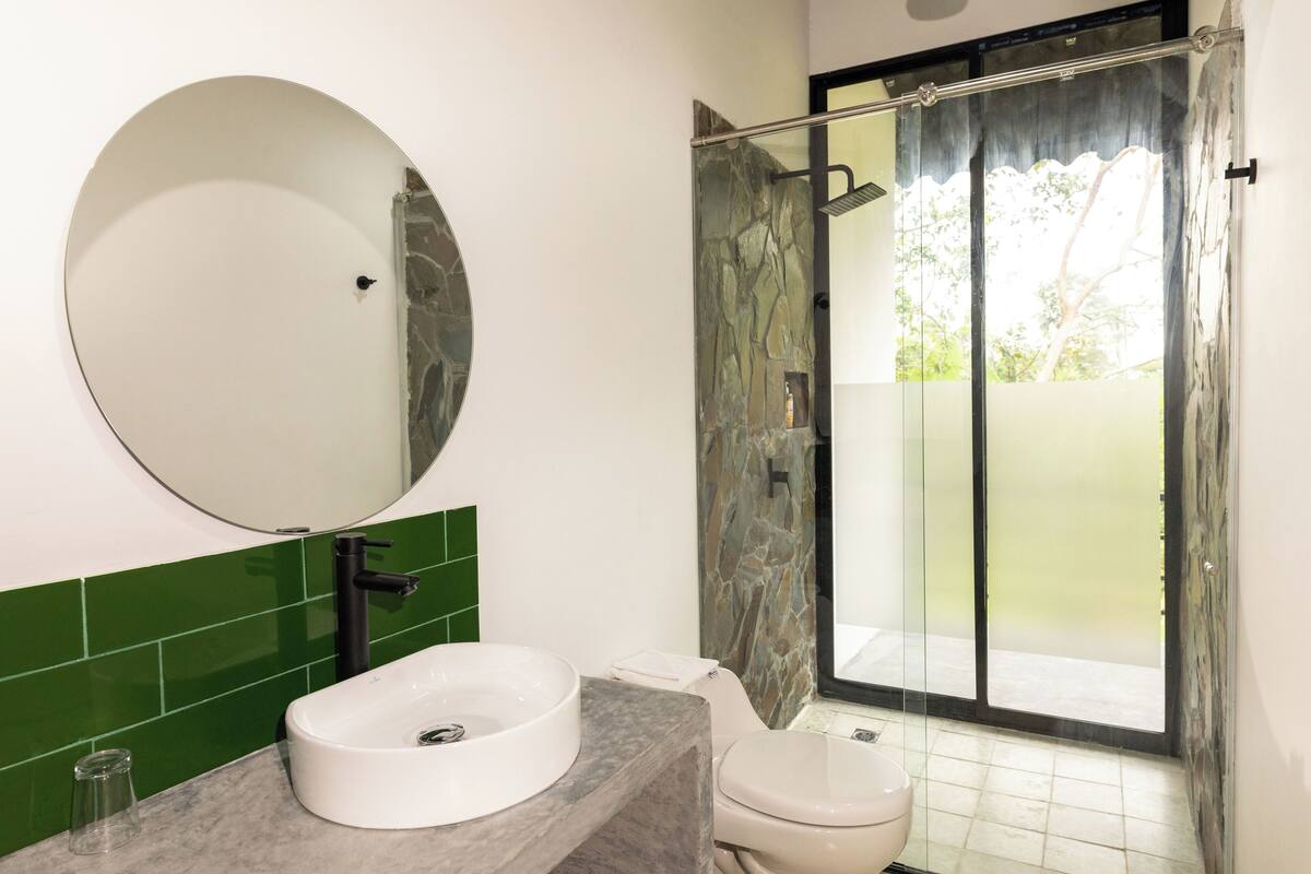 luxury room | bathroom | shower, designer toiletries, towels, toilet paper