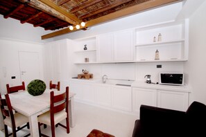 Superior Apartment | Private kitchen | Full-size fridge, microwave, stovetop, coffee/tea maker