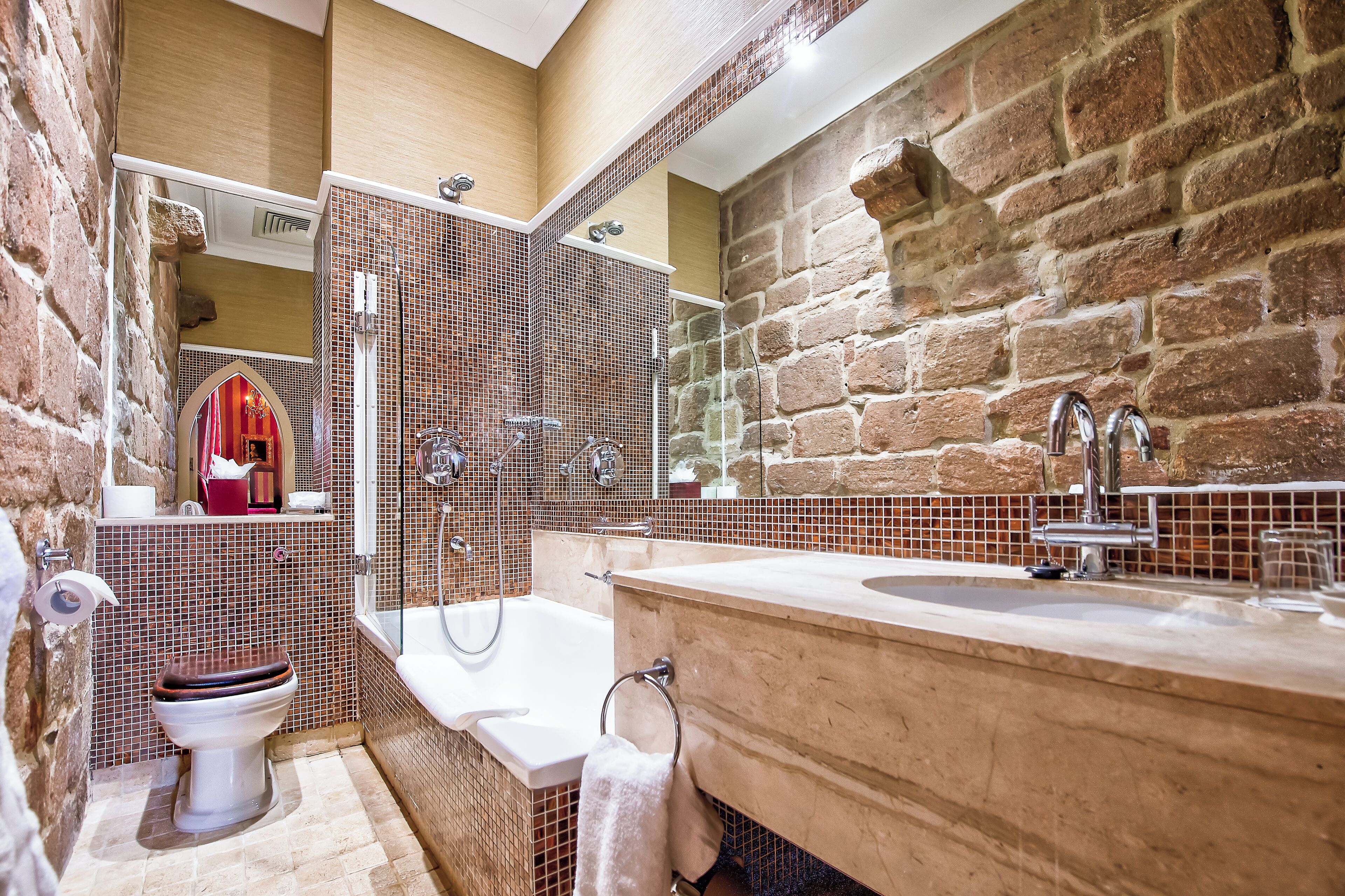 A bathroom with a bathtub, a sink, and a toilet.