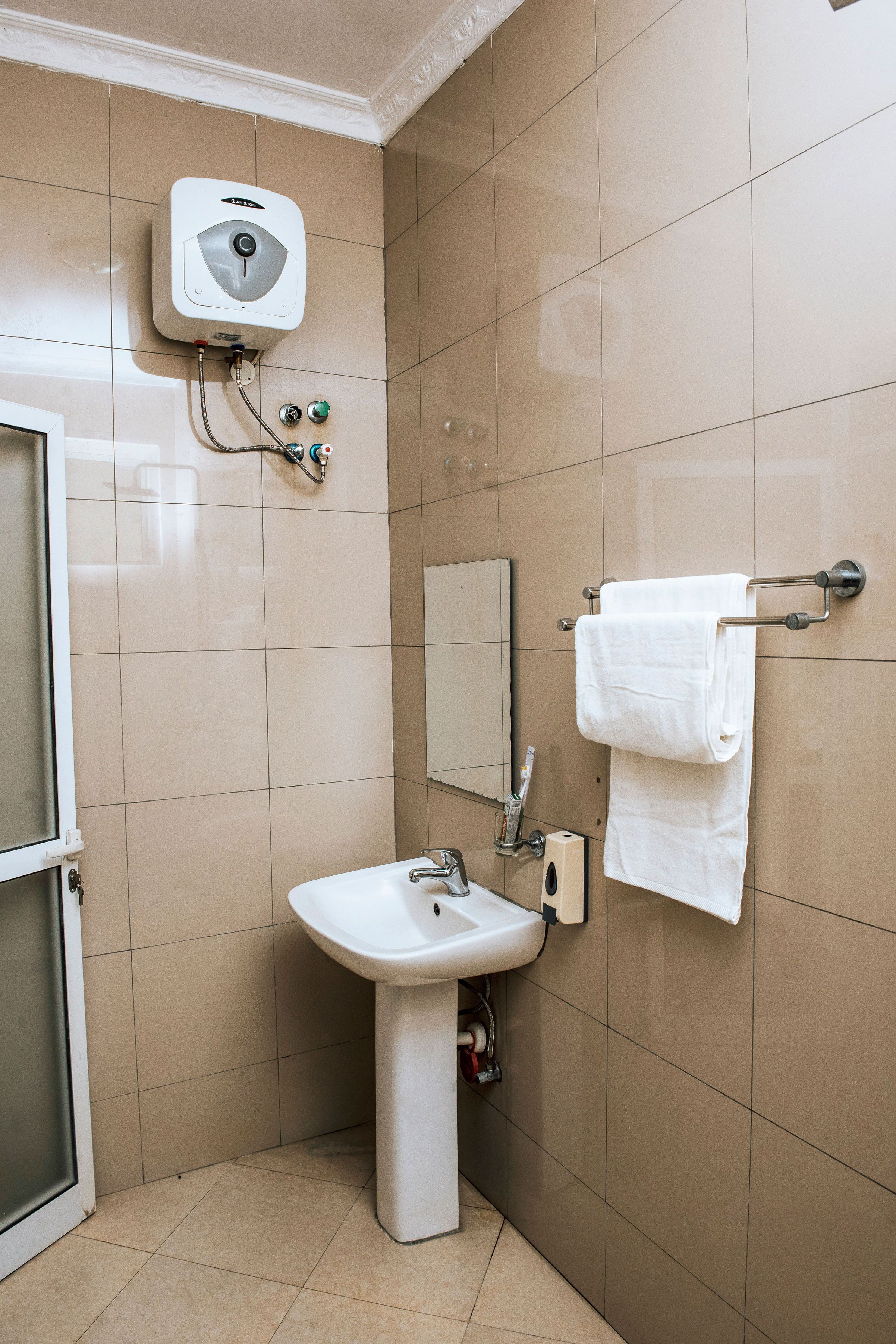 deluxe single room | bathroom | shower, slippers, bidet, towels