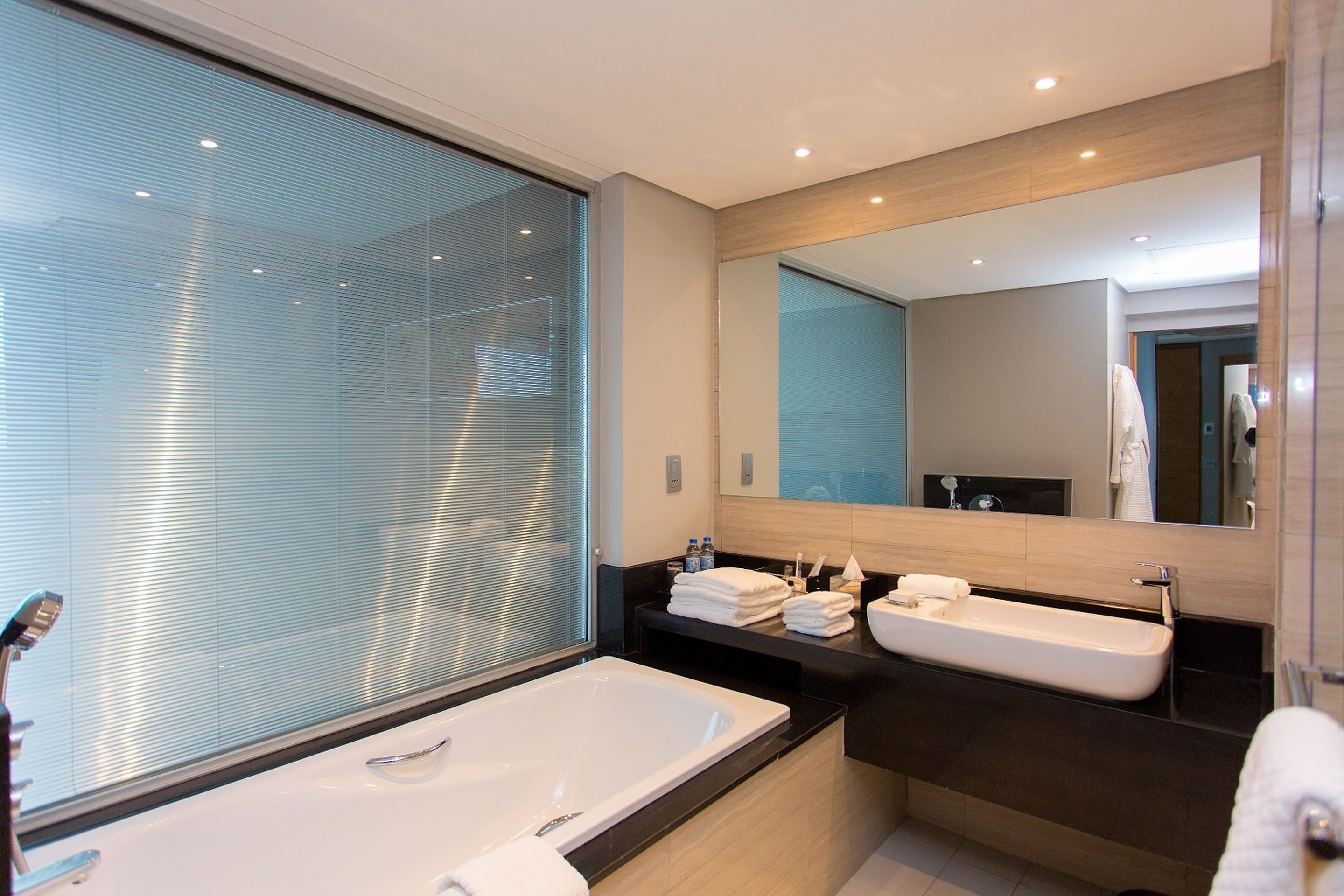 hair dryer, slippers, towels, soap