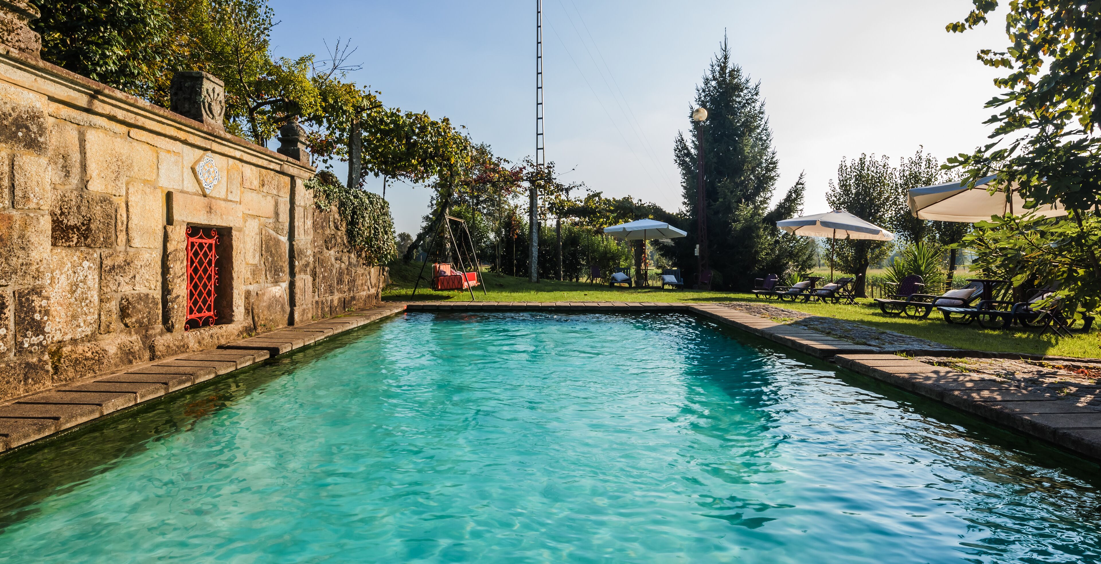 Outdoor pool, a natural pool, sun loungers