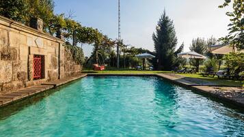 Outdoor pool, a natural pool, sun loungers