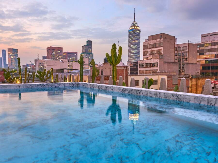 Outdoor pool, open 8:00 AM to 8:00 PM, pool umbrellas, pool loungers