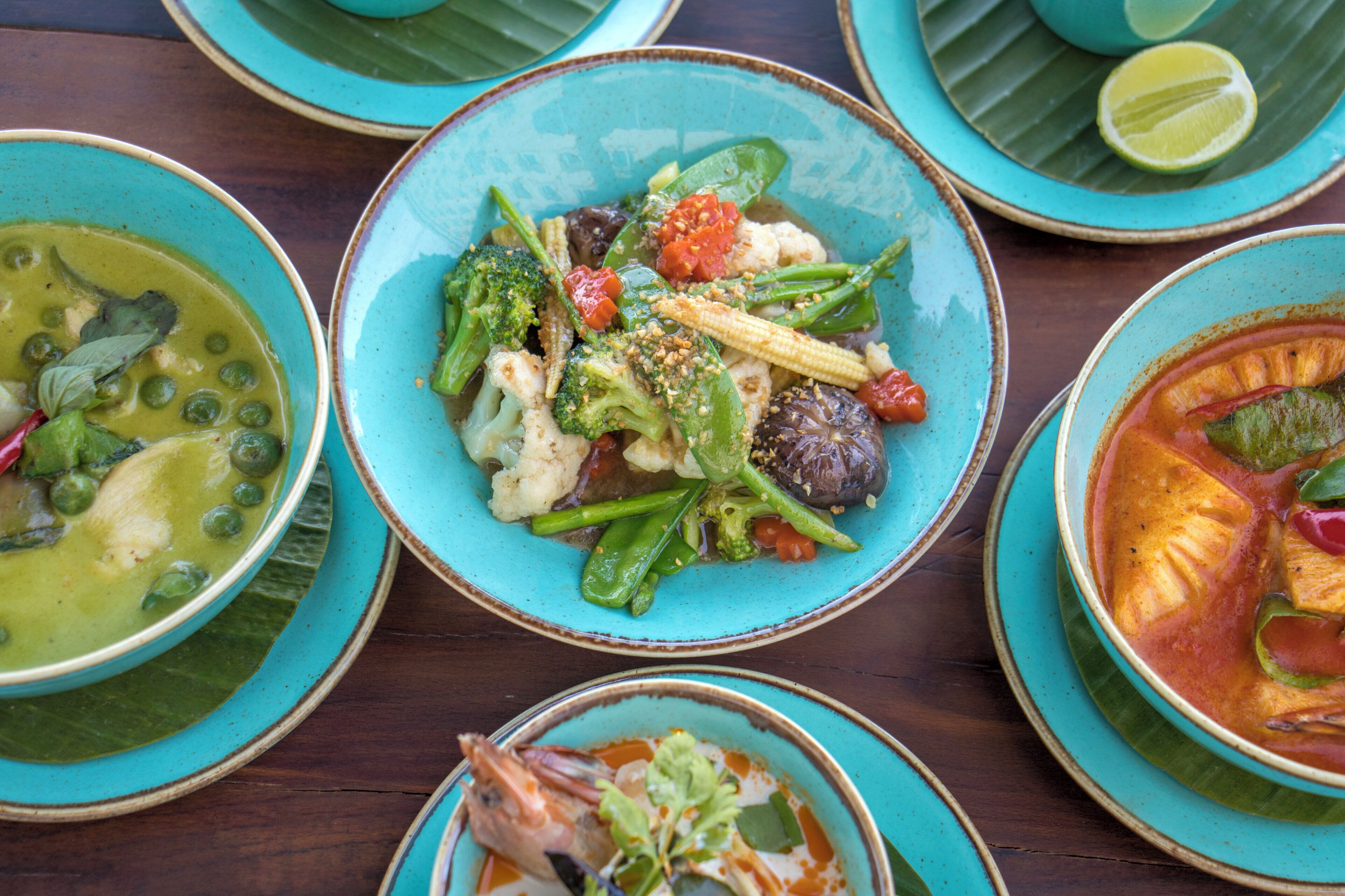 A variety of dishes in different bowls, suggesting a diverse menu.