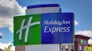 A Holiday Inn Express sign with a prominent 'HH' logo.