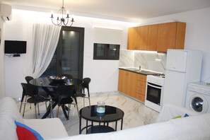 Apartment, 2 Bedrooms | Living area | 24-inch LED TV with satellite channels, TV - Salonikiou Beach Deluxe Apartments (Sithonia)
