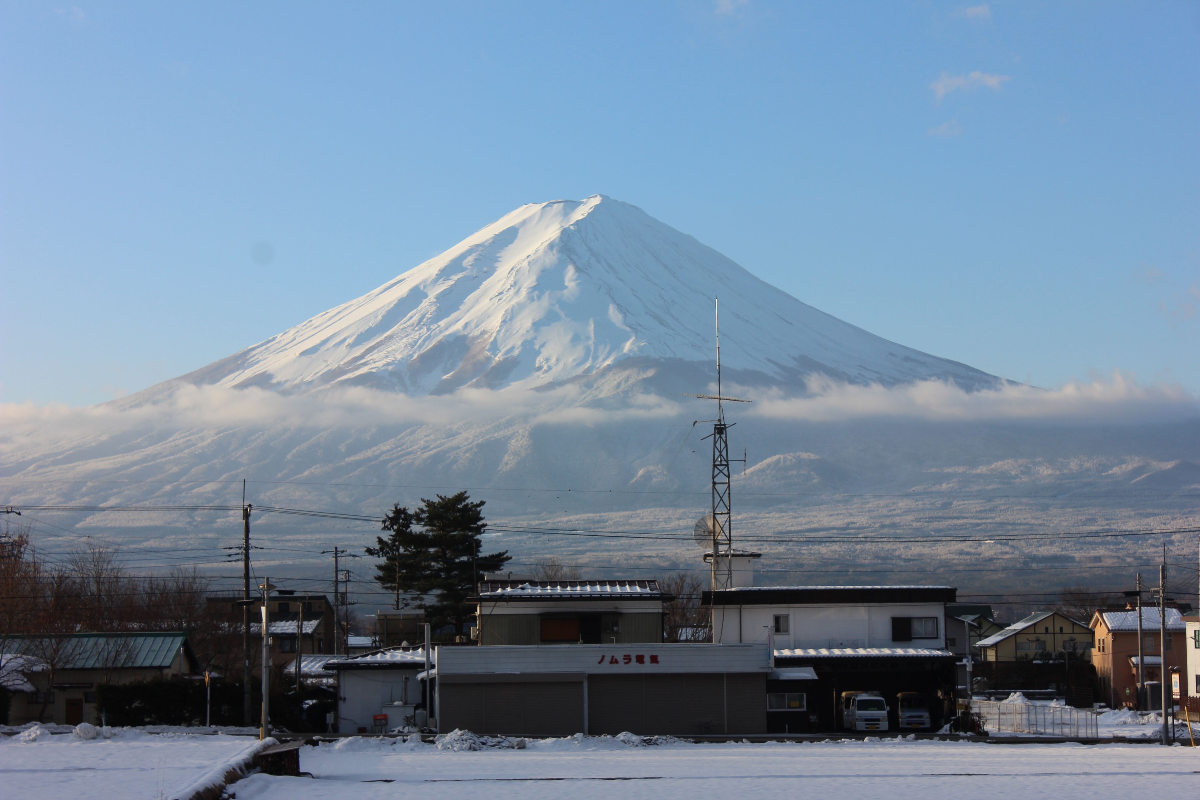 A snow-covered mountain with a clear sky.