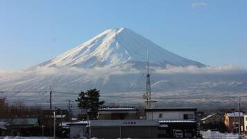 A snow-covered mountain with a clear sky.