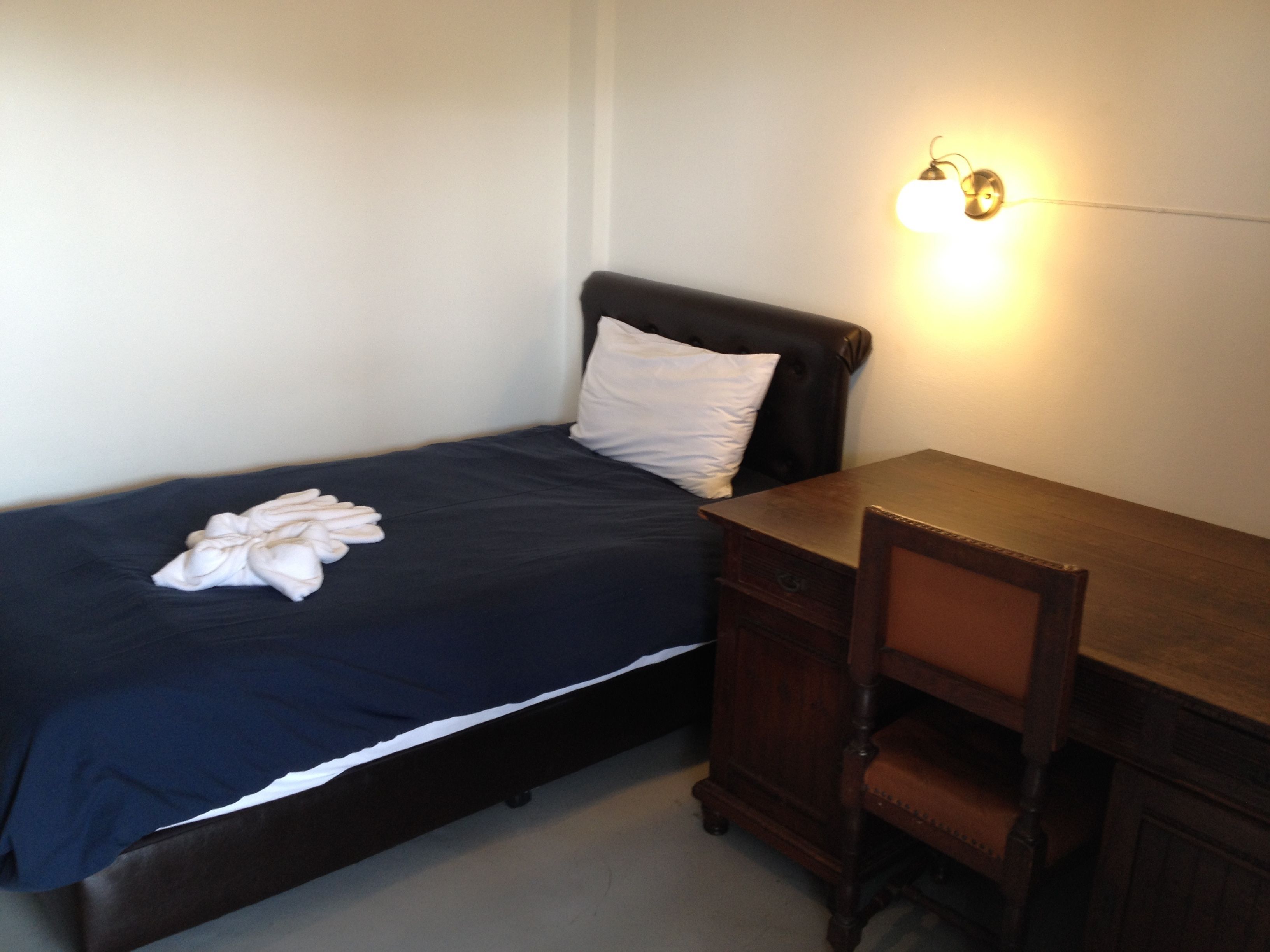 single room | 1 bedroom, free minibar items, in-room safe, soundproofing