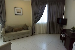 Executive Double Room, Ocean View | Living area | 32-inch flat-screen TV with satellite channels, TV