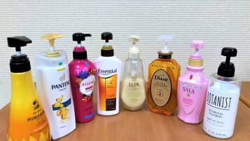 A variety of hotel toiletries on a table.