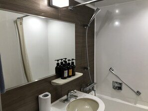 Combined shower/tub, free toiletries, hair dryer, slippers