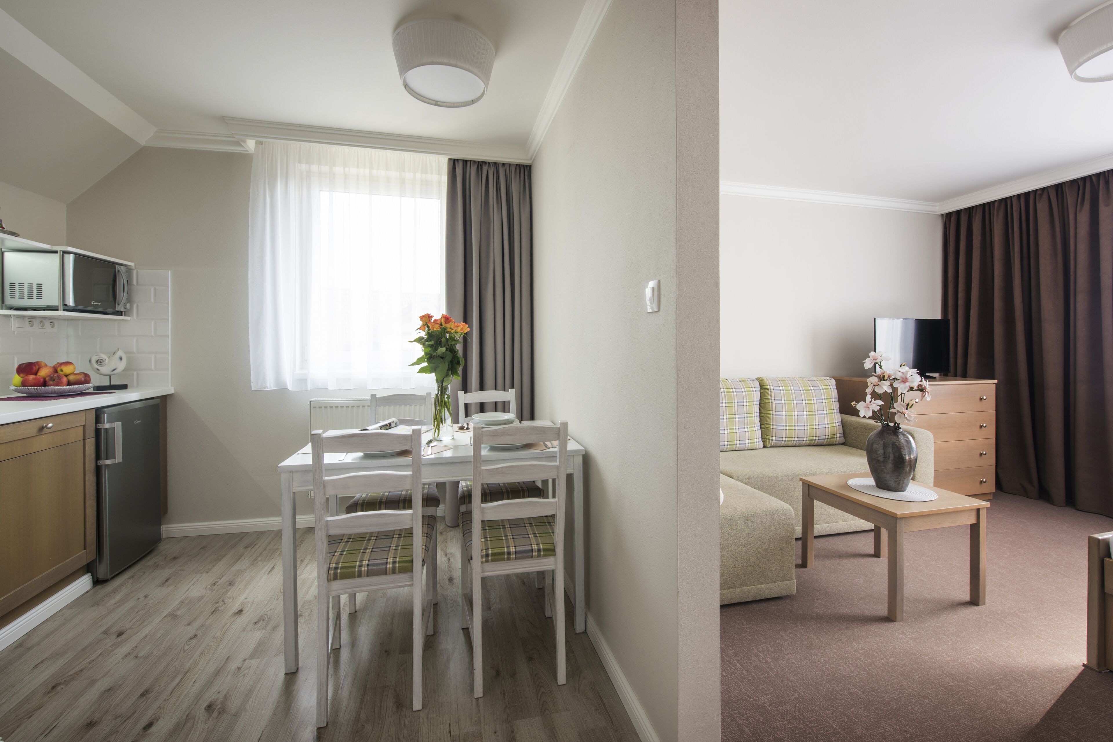 Deluxe Double Room, 1 King Bed, Kitchenette | Living area | Flat-screen TV