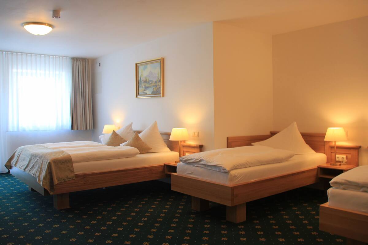 deluxe quadruple room | hypo-allergenic bedding, desk, iron/ironing board, free cots/infant beds