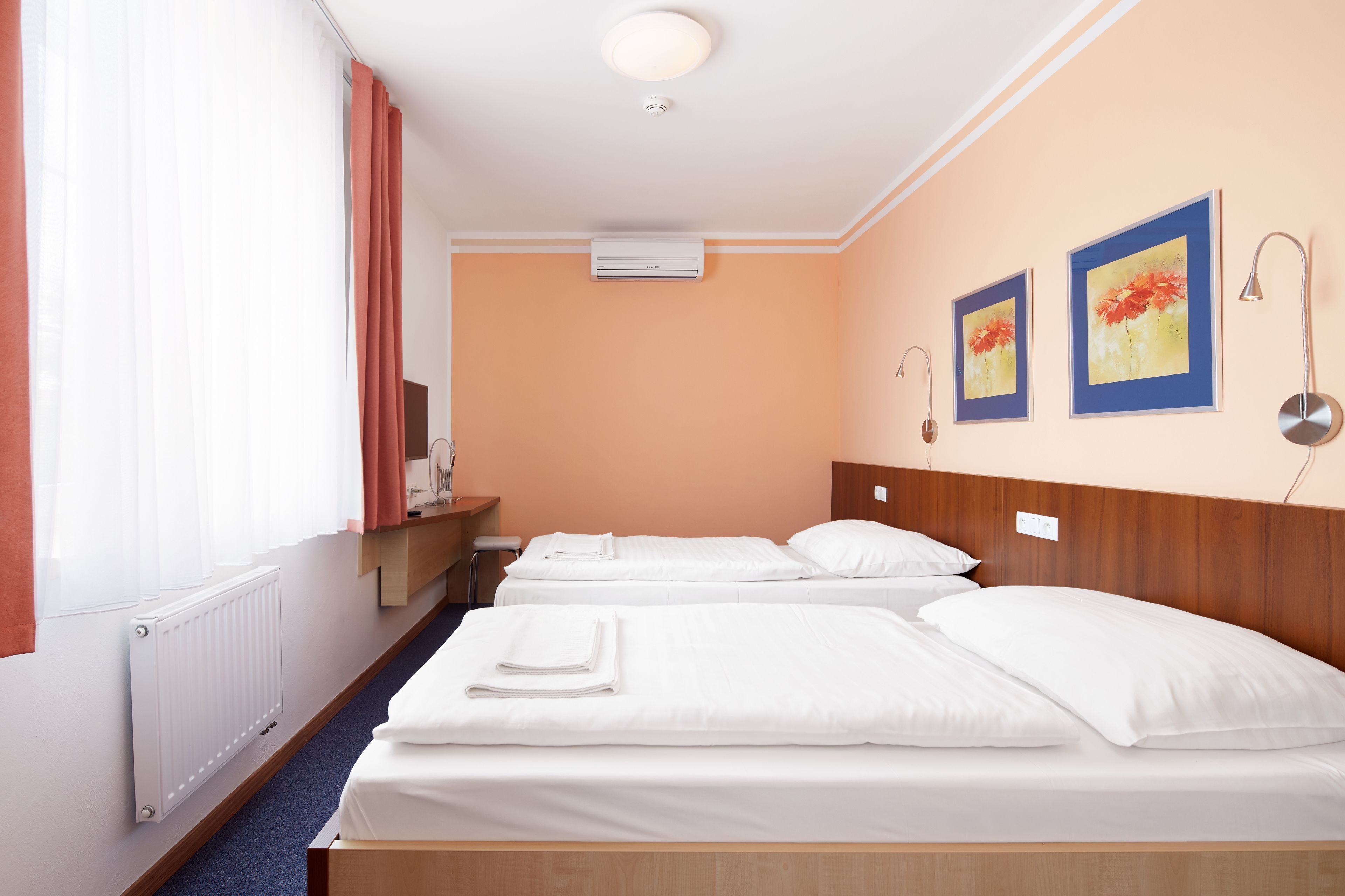 Premium bedding, pillow-top beds, desk, blackout curtains