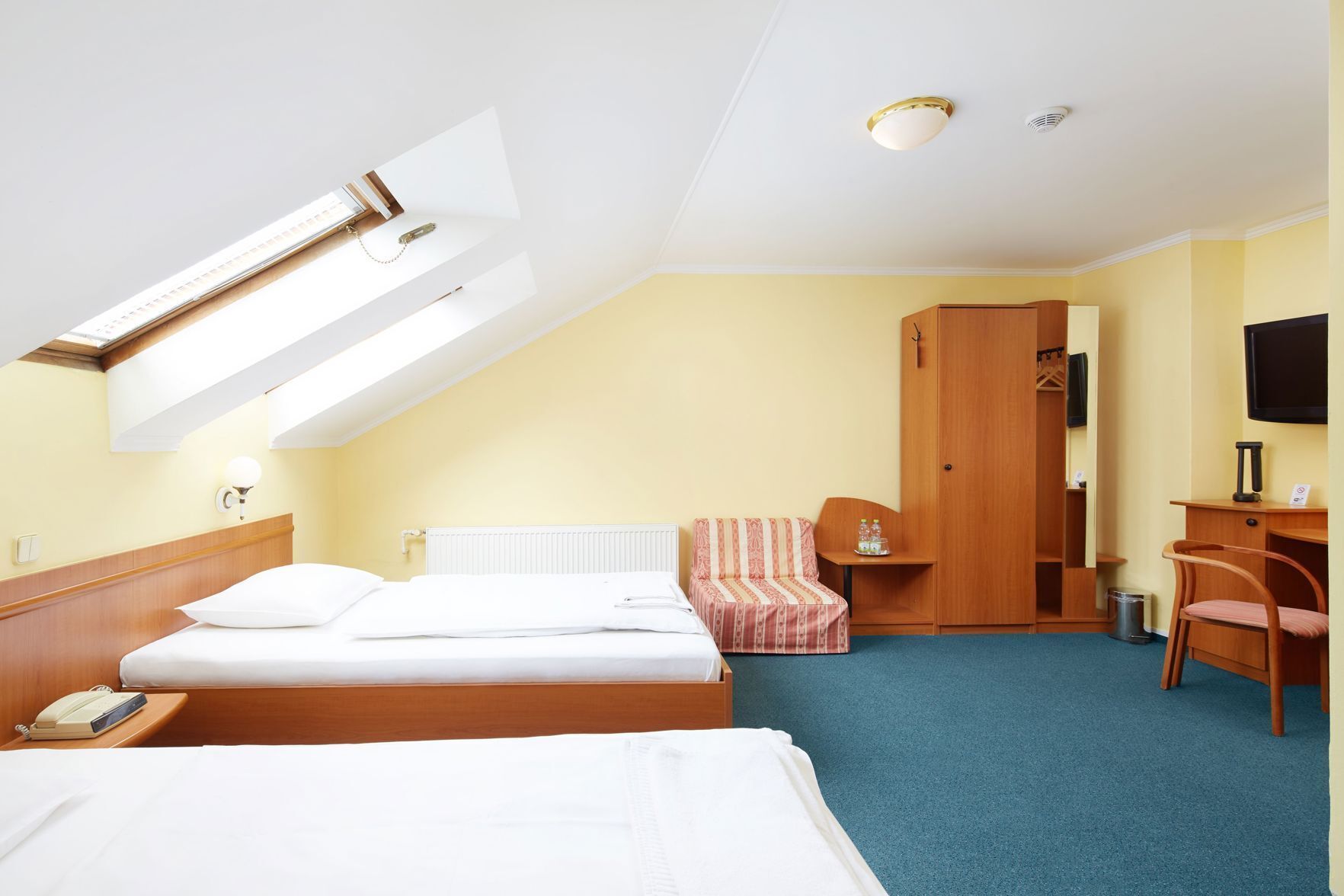 Premium bedding, pillow-top beds, desk, blackout curtains