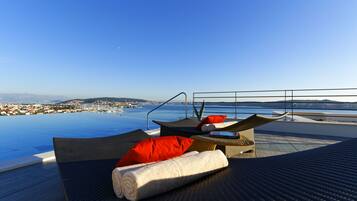 Indoor pool, seasonal outdoor pool, pool umbrellas, sun loungers