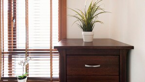 A wooden desk with a potted plant and a small white pot with a plant. - MetroStays - Temple Bar 18 (Dublin)