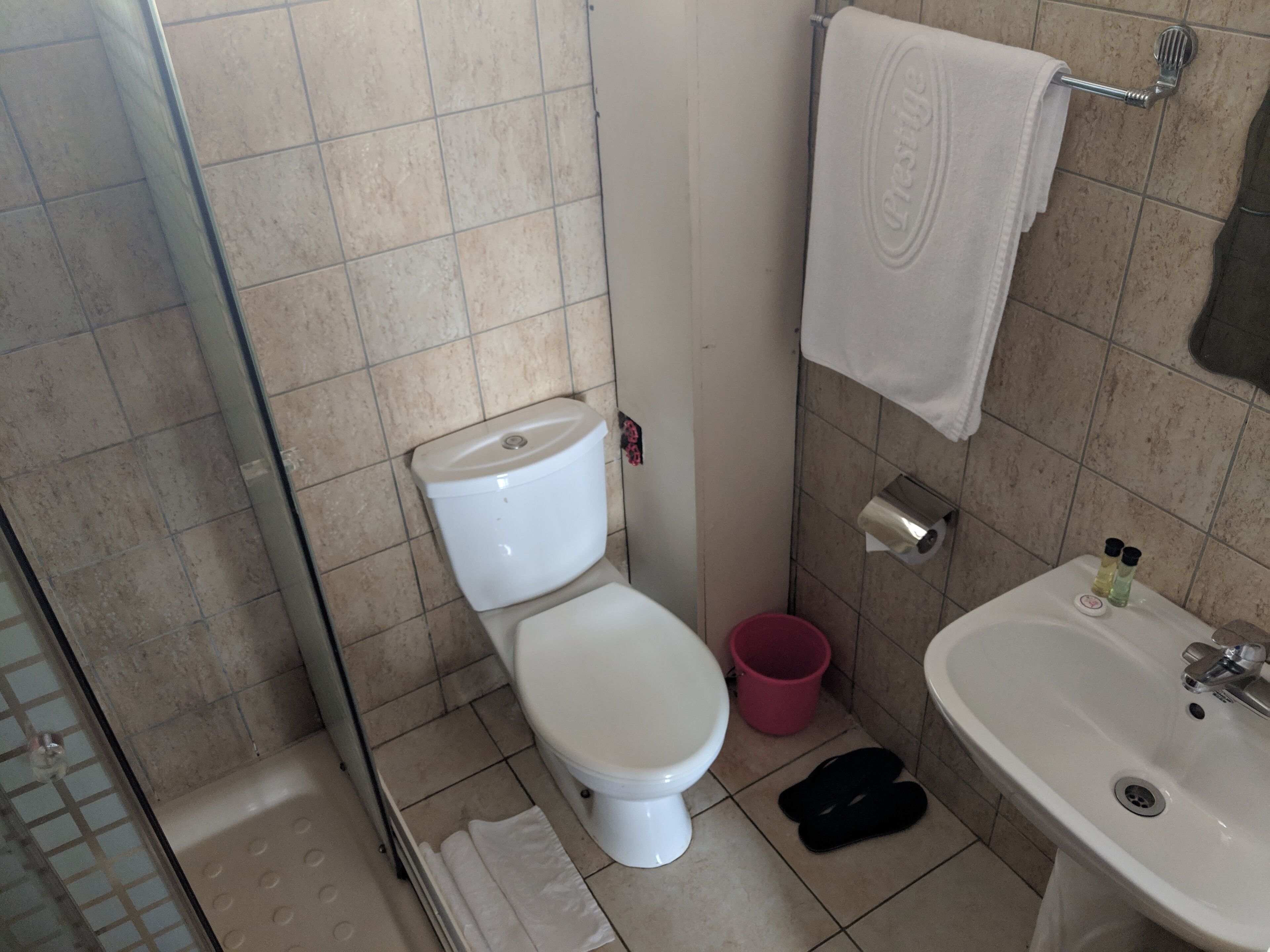 shower, free toiletries, slippers, towels