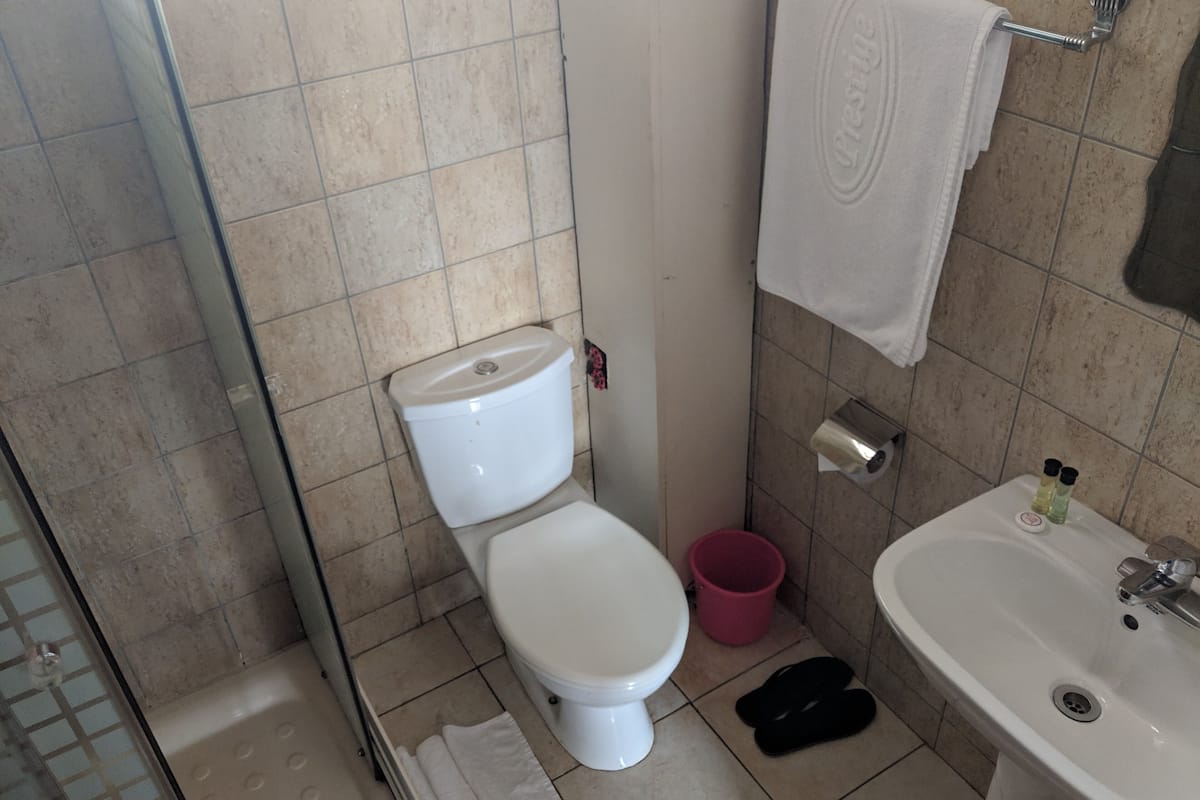 shower, free toiletries, slippers, towels