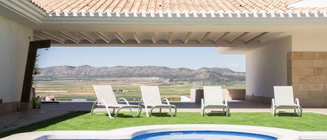 Seasonal outdoor pool, pool umbrellas