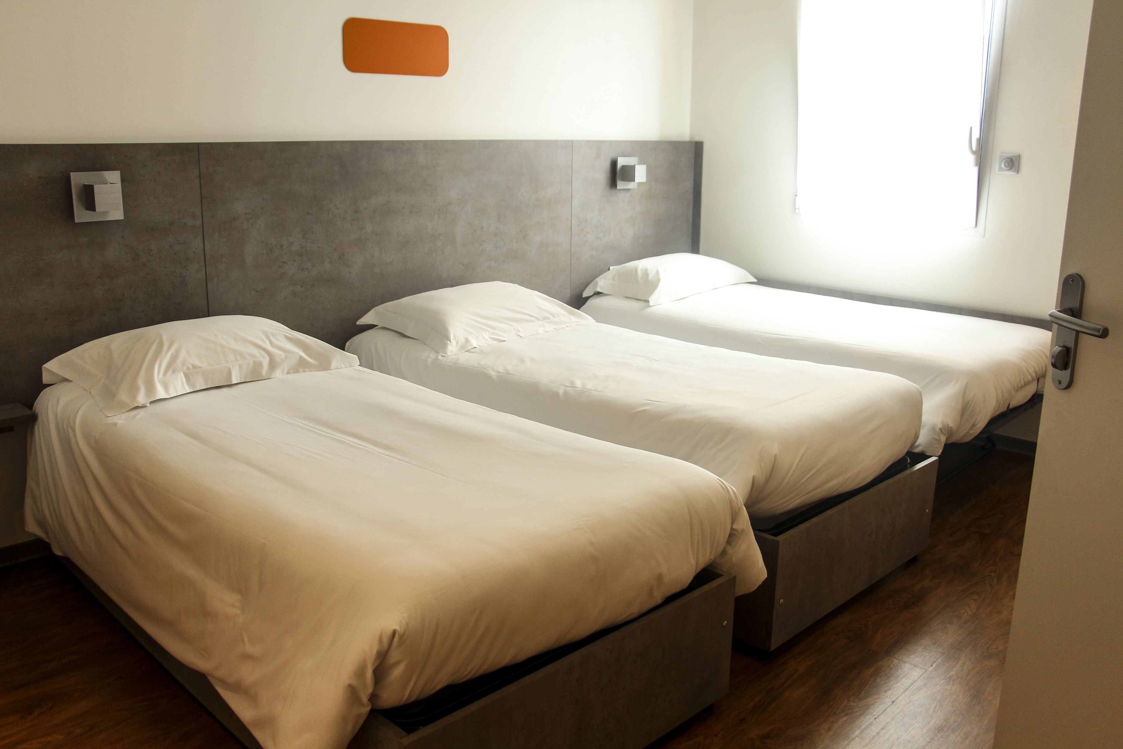 triple room | premium bedding, desk, blackout curtains, soundproofing