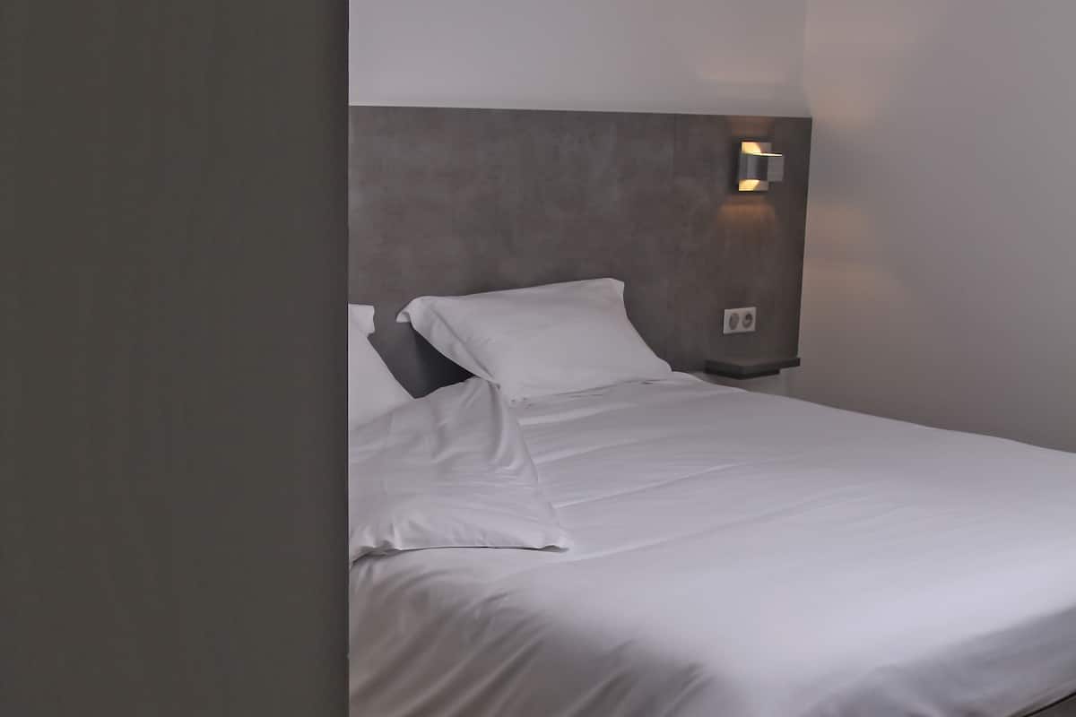 superior room | premium bedding, desk, blackout curtains, soundproofing