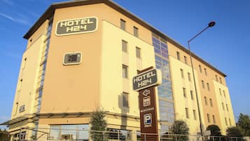 Experience 24-hour convenience at Hotel H24, featuring a modern design and parking.