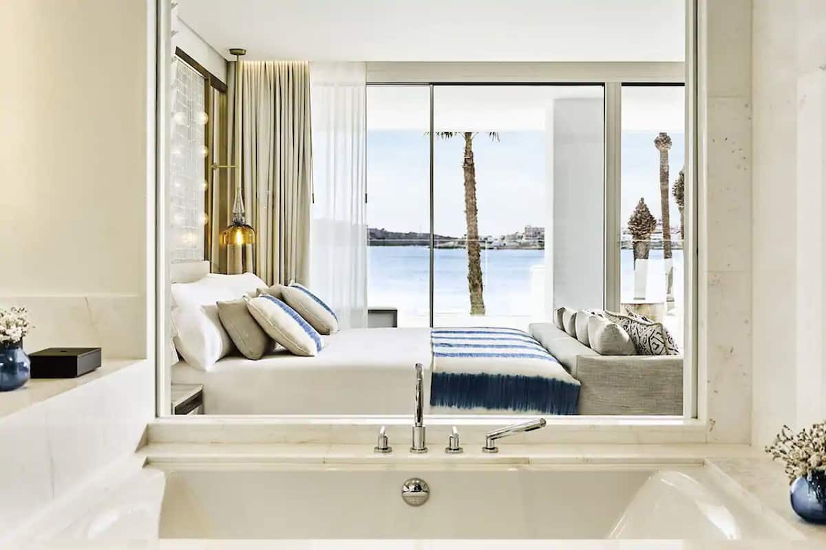 designer toiletries, hair dryer, bathrobes, towels