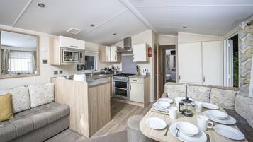 2 Bedroom Gold Caravan | Private kitchen | Full-size fridge, microwave, oven