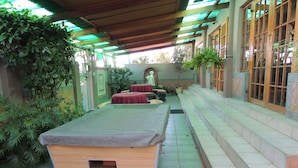 A pool table in a covered outdoor area with steps leading up to a building. - Rita Guest House (Abaqulusi)