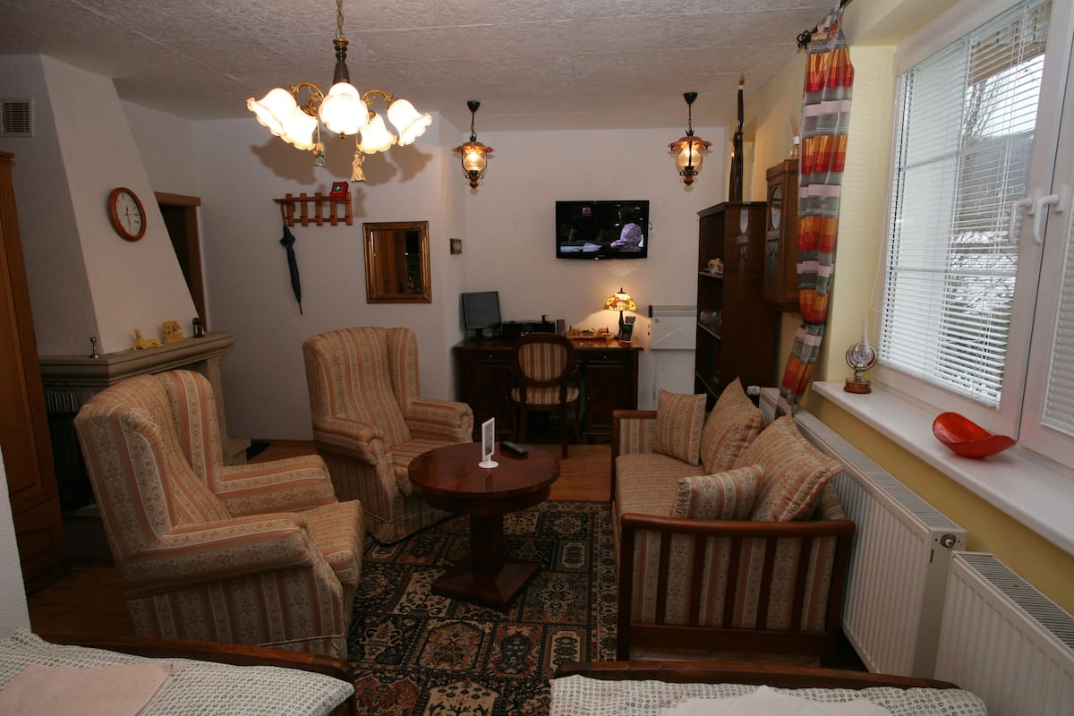 Deluxe Studio Suite, 1 Bedroom, Kitchenette, Garden View | Living area | 82-cm LED TV with cable channels, TV