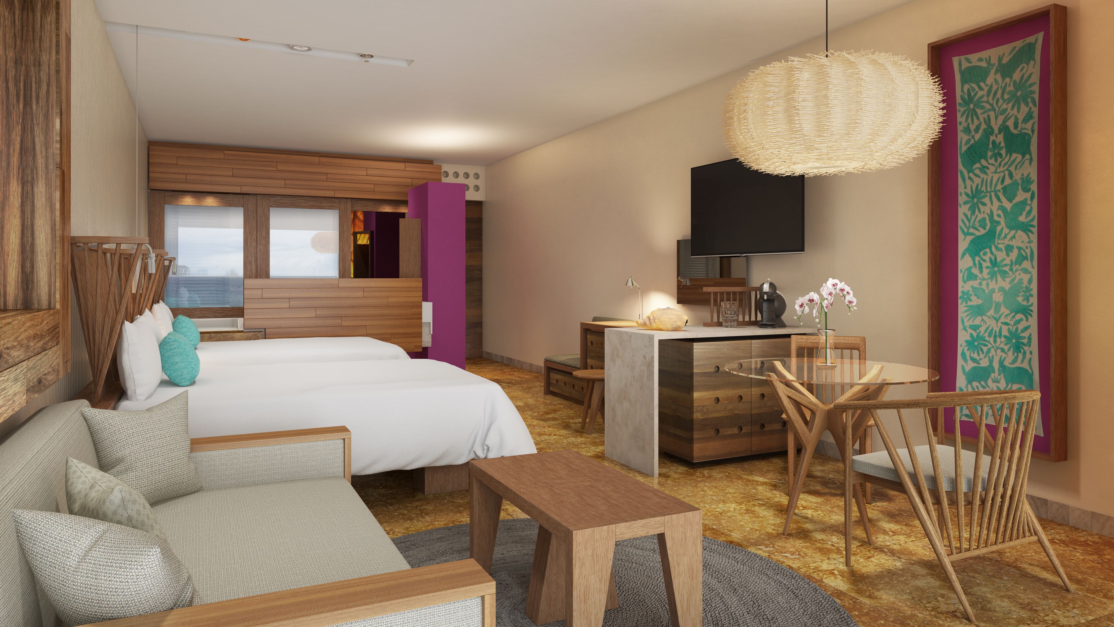 A modern hotel room with a large bed, a sofa, a desk, and a TV.